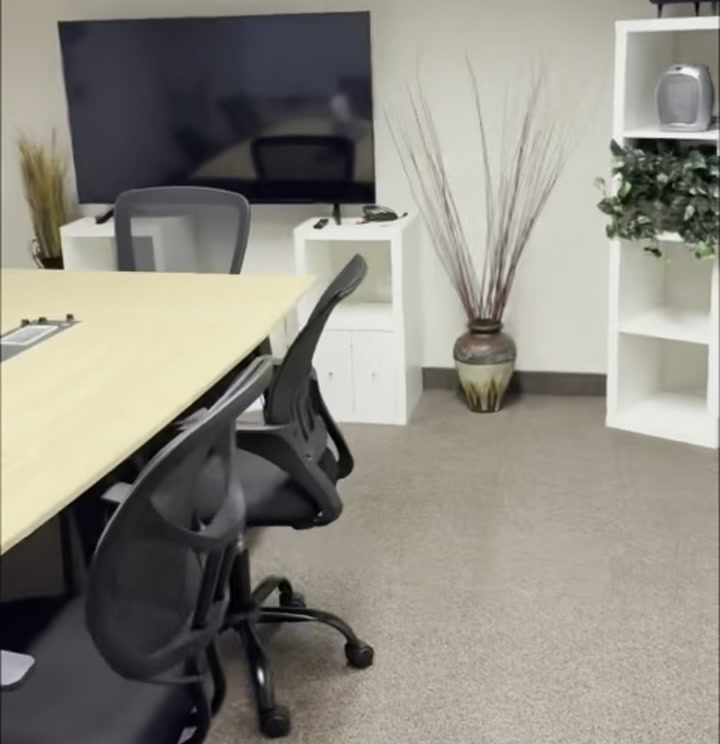 Wooden door labeled Dutch Oven opening into the private conference room at Boise Main Co-working Space